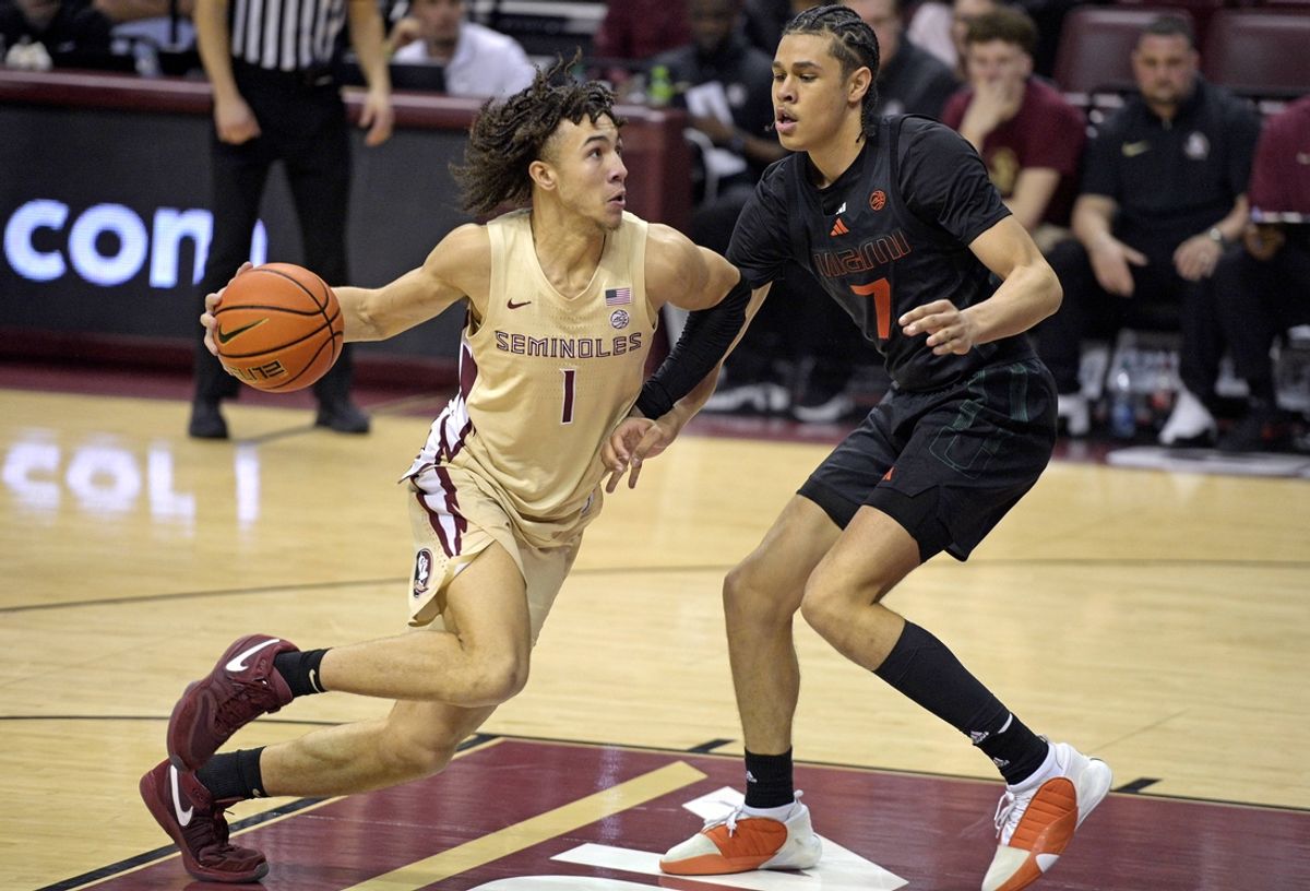 Mar 9, 2024; Tallahassee, Florida, USA; Florida State Seminoles guard Jalen Warley (1) drives to the basket against Miami Hurricanes guard Kyshawn George (7) during the second half at Donald L. Tucker Center. Mandatory Credit: Melina Myers-Imagn Images