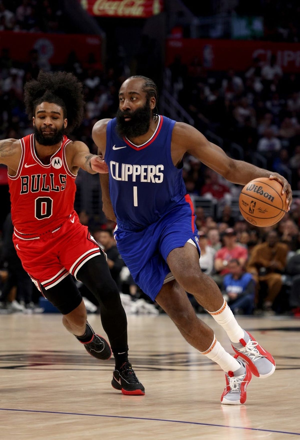 Mar 9, 2024; Los Angeles, California, USA; LA Clippers guard James Harden (1) dribbles against Chicago Bulls guard Coby White (0) during the fourth quarter at Crypto.com Arena. Mandatory Credit: Jason Parkhurst-Imagn Images