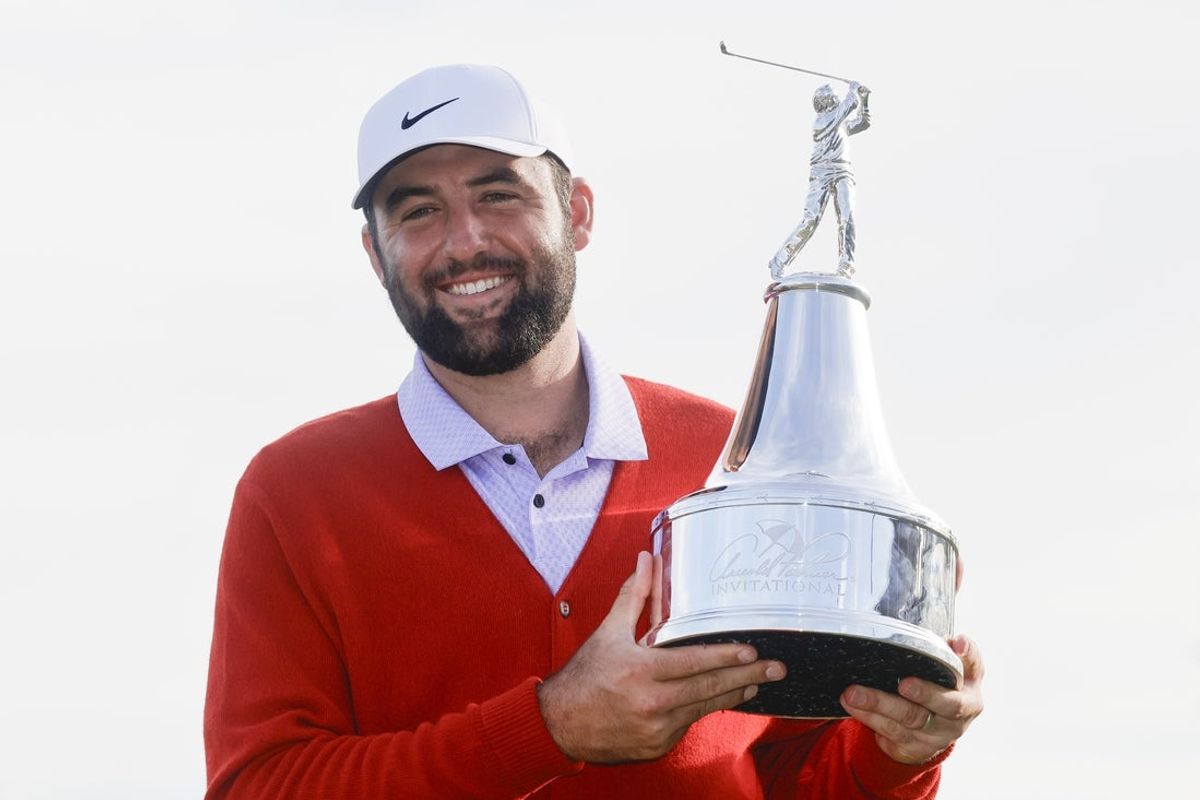 Mar 10, 2024; Orlando, Florida, USA; Scottie Scheffler holds the champions trophy after winning the Arnold Palmer Invitational golf tournament. Mandatory Credit: Reinhold Matay-Imagn Images