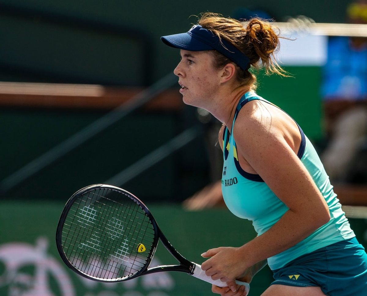 Linda Noskova awaits a serve from Iga Swiatek during round three of the BNP Paribas Open in Indian Wells, Calif., Sunday, March 10, 2024.