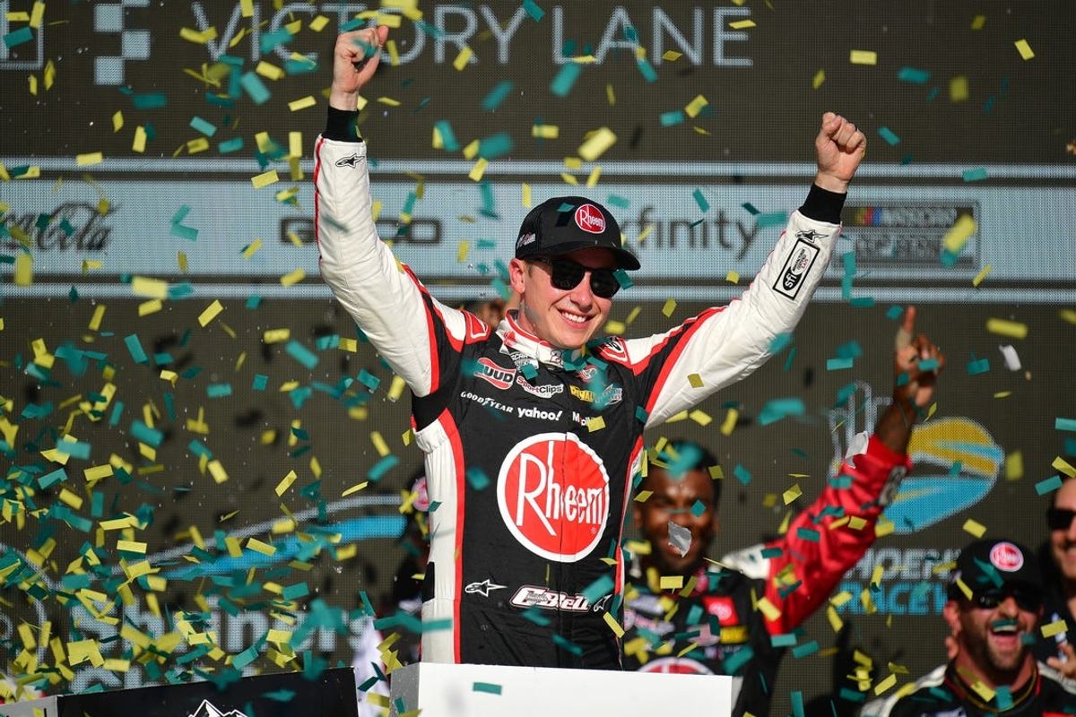 Mar 10, 2024; Avondale, Arizona, USA; NASCAR Cup Series driver Christopher Bell (20) celebrates his victory of the Shriners Childrens 500 at Phoenix Raceway. Mandatory Credit: Gary A. Vasquez-USA TODAY Sports