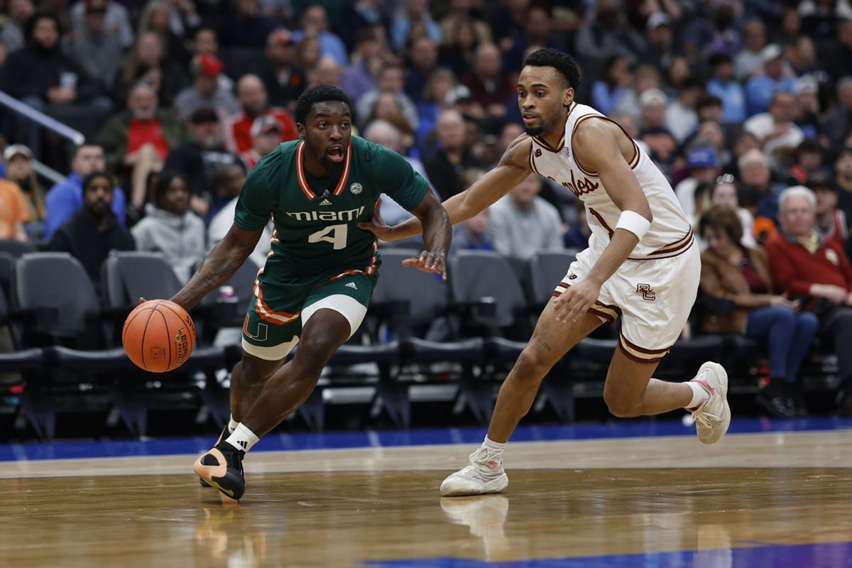 Mar 12, 2024; Washington, D.C., USA; Miami (Fl) Hurricanes guard Bensley Joseph (4) drives to the basket as Boston College Eagles guard Claudell Harris Jr. (1) defends in the first half at Capital One Arena. Mandatory Credit: Geoff Burke-Imagn Images