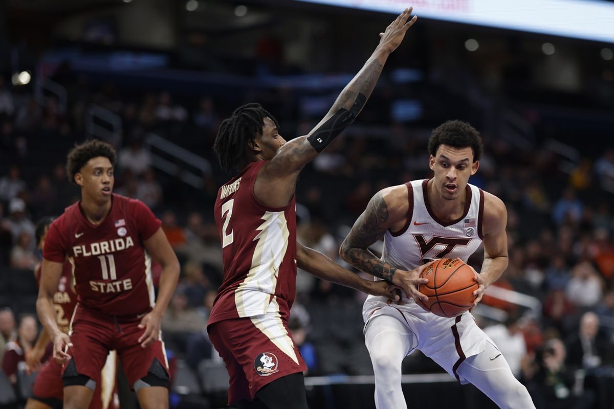 Mar 13, 2024; Washington, D.C., USA; Virginia Tech Hokies center Lynn Kidd (15) drives to the basket as Florida State Seminoles forward Jamir Watkins (2) defends in the first half at Capital One Arena. Mandatory Credit: Geoff Burke-Imagn Images