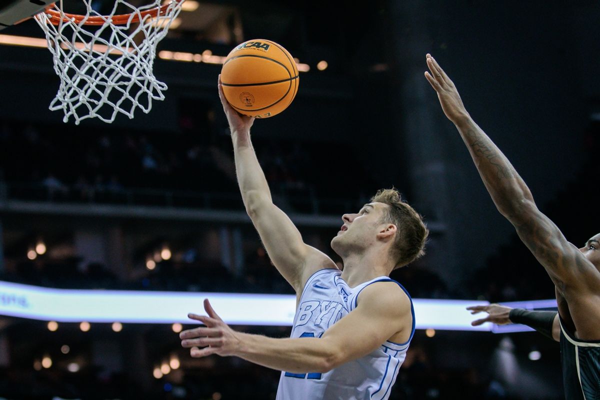 Mar 13, 2024; Kansas City, MO, USA; Brigham Young Cougars guard Trevin Knell (21) shoots the ball during the first half against the UCF Knights at T-Mobile Center. Mandatory Credit: William Purnell-Imagn Images
