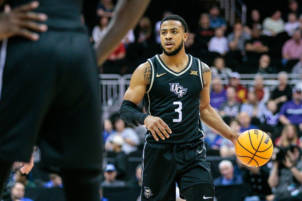 Mar 13, 2024; Kansas City, MO, USA; UCF Knights guard Darius Johnson (3) brings the ball up court during the second half against the Brigham Young Cougars at T-Mobile Center. Mandatory Credit: William Purnell-Imagn Images