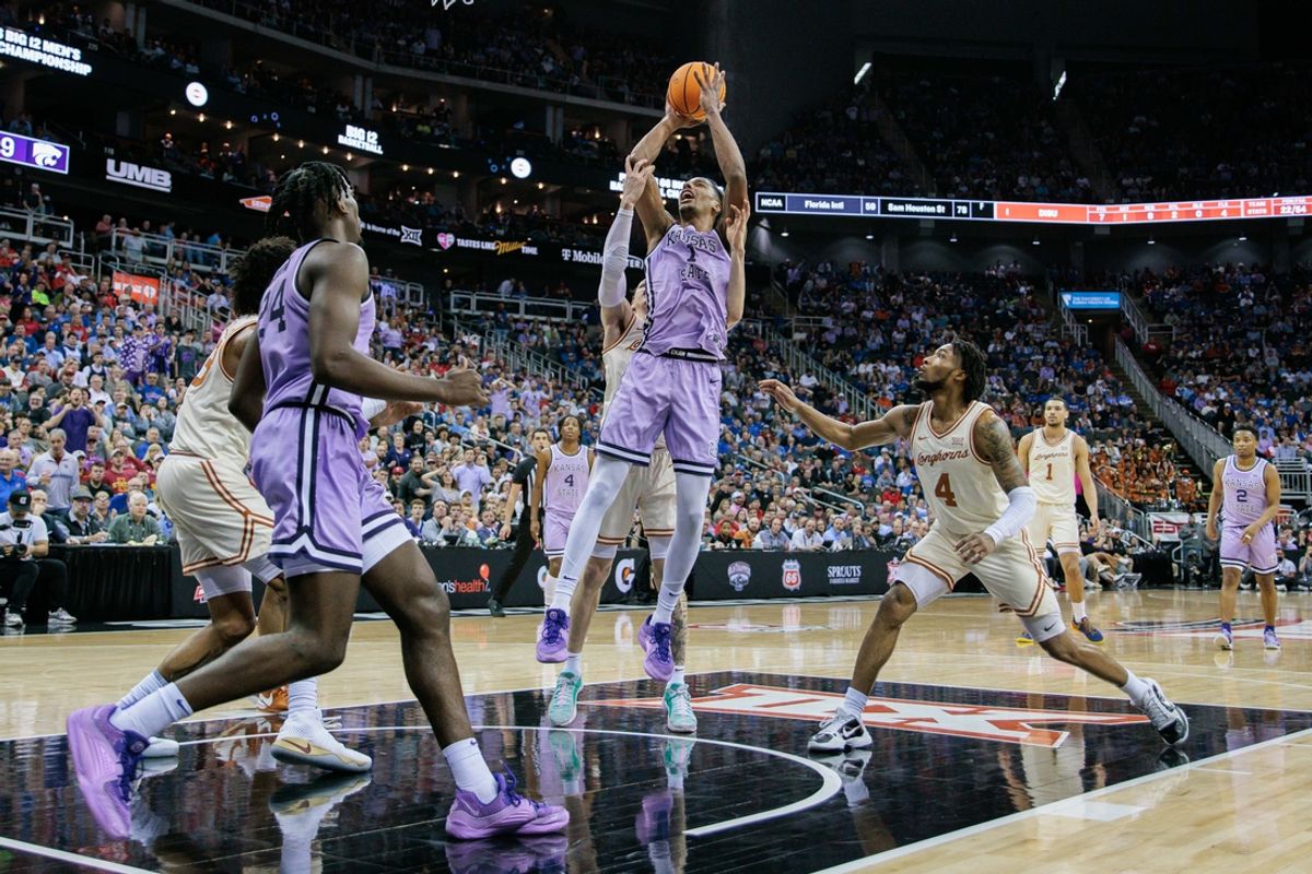 Mar 13, 2024; Kansas City, MO, USA; Kansas State Wildcats forward David N'Guessan (1) shoots the ball during the first half against the Texas Longhorns at T-Mobile Center. Mandatory Credit: William Purnell-Imagn Images