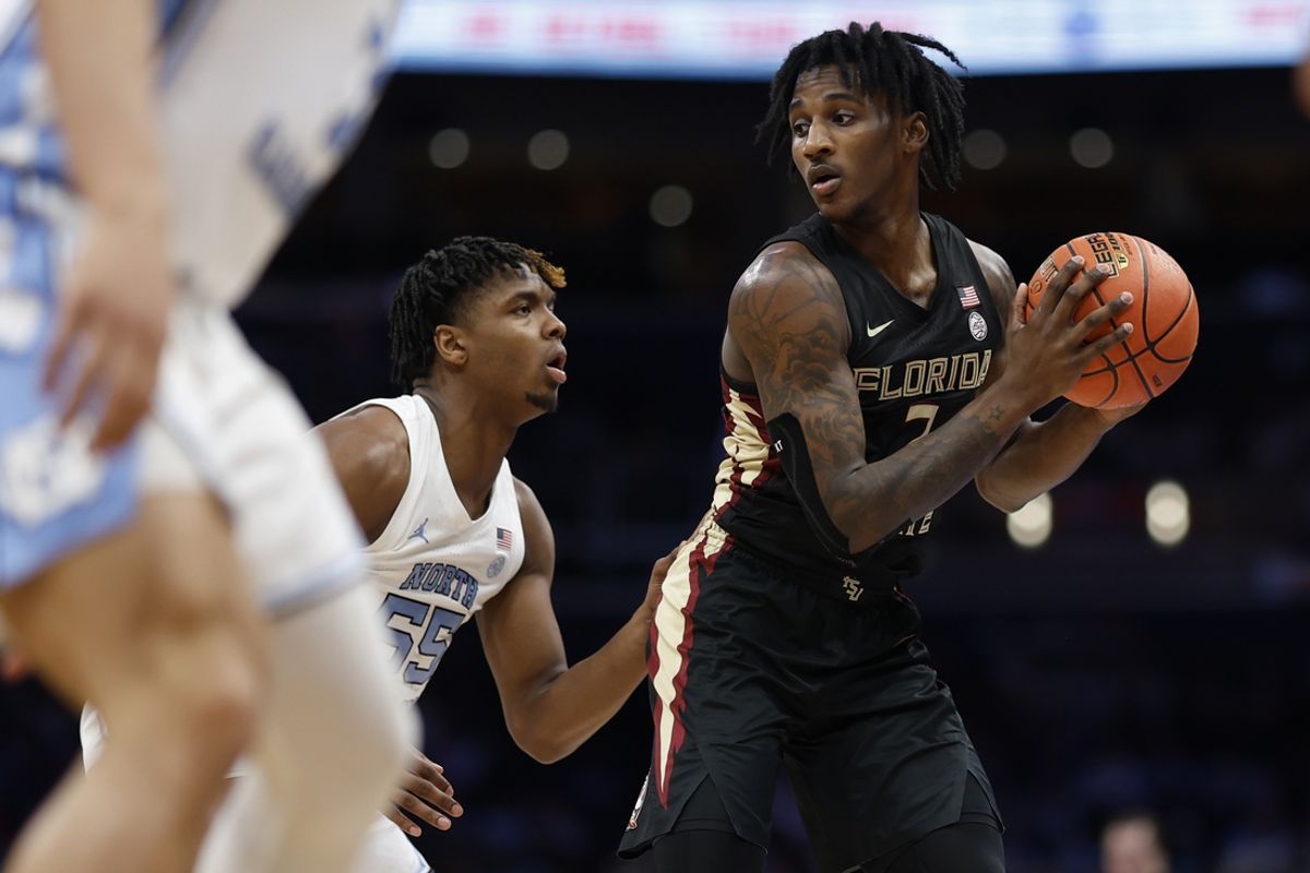 Mar 14, 2024; Washington, D.C., USA; Florida State forward Jamir Watkins (2) holds the ball as North Carolina forward Harrison Ingram (55) defends in the first half at Capital One Arena. Mandatory Credit: Geoff Burke-Imagn Images