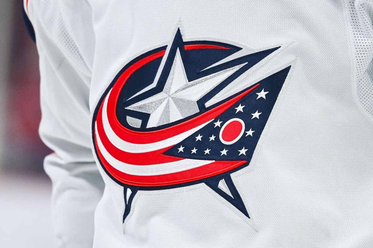 Mar 12, 2024; Montreal, Quebec, CAN; View of a Columbus Blue Jackets logo on a jersey worn by a member of the team during warm-up before the game against the Montreal Canadiens at Bell Centre. Mandatory Credit: David Kirouac-Imagn Images