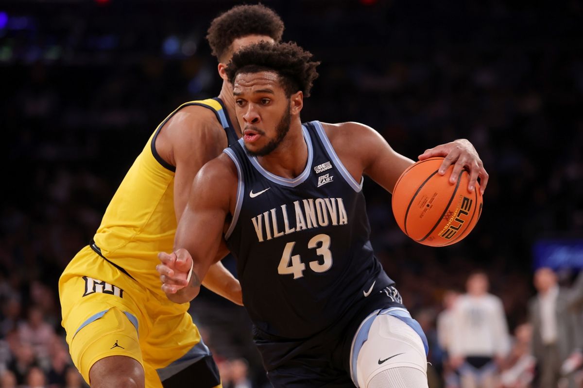 Mar 14, 2024; New York City, NY, USA; Villanova Wildcats forward Eric Dixon (43) drives to the basket against Marquette Golden Eagles forward Oso Ighodaro (13) during the first half at Madison Square Garden. Mandatory Credit: Brad Penner-Imagn Images