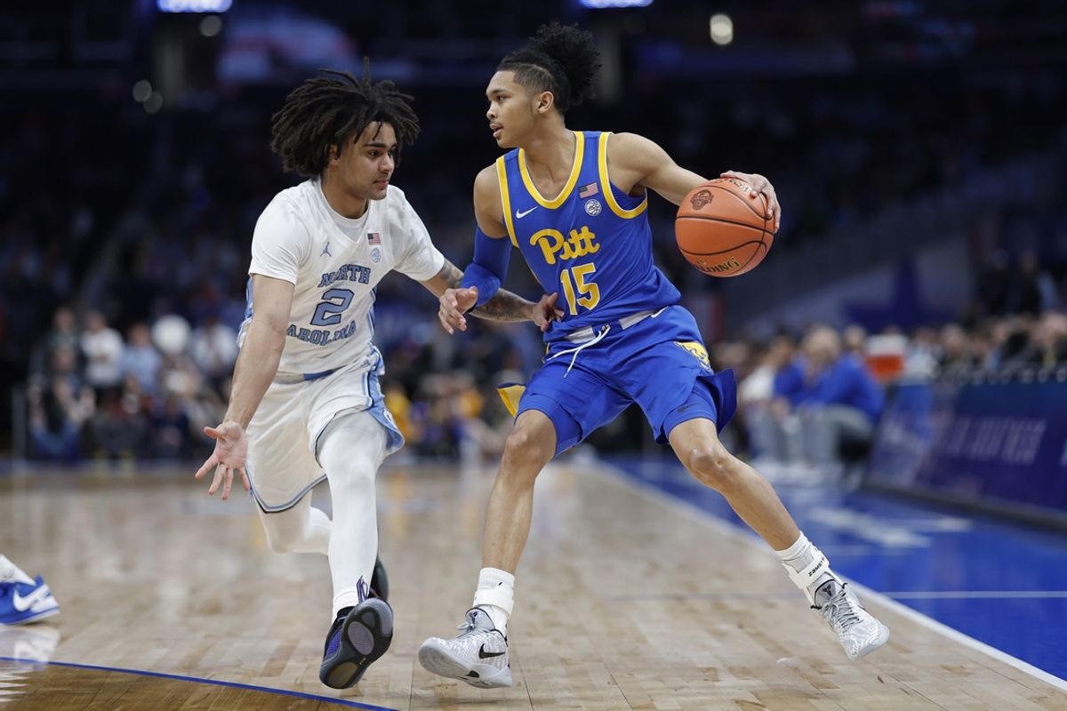 Mar 15, 2024; Washington, D.C., USA; Pittsburgh Panthers guard Jaland Lowe (15) dribbles the ball as North Carolina Tar Heels guard Elliot Cadeau (2) defends in the first half at Capital One Arena. Mandatory Credit: Geoff Burke-Imagn Images