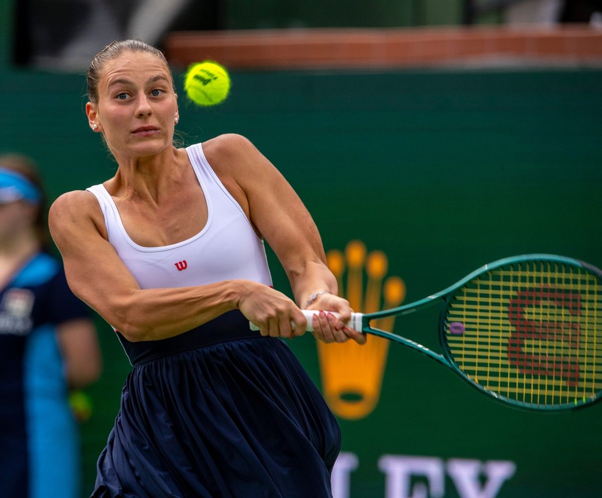 Marta Kostyuk hits to Iga Swiatek during the WTA semifinals of the BNP Paribas Open in Indian Wells, Calif., Friday, March 15, 2024.