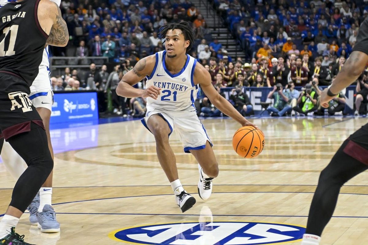 Mar 15, 2024; Nashville, TN, USA; Kentucky Wildcats guard D.J. Wagner (21) dribbles against the Texas A&M Aggies during the second half at Bridgestone Arena. Mandatory Credit: Steve Roberts-USA TODAY Sports