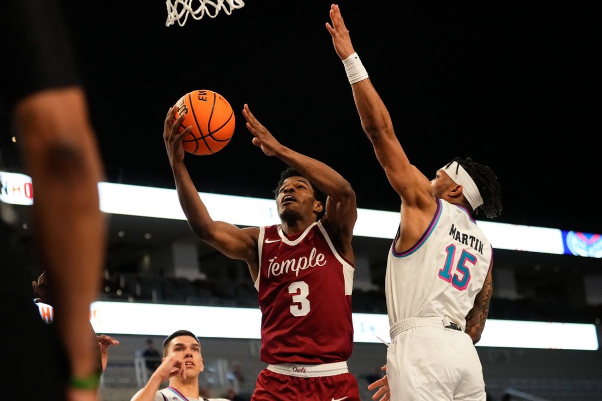Mar 16, 2024; Fort Worth, TX, USA; Temple Owls guard Hysier Miller (3) scores a layup against Florida Atlantic Owls guard Alijah Martin (15) during the second half at Dickies Arena. Mandatory Credit: Chris Jones-Imagn Images