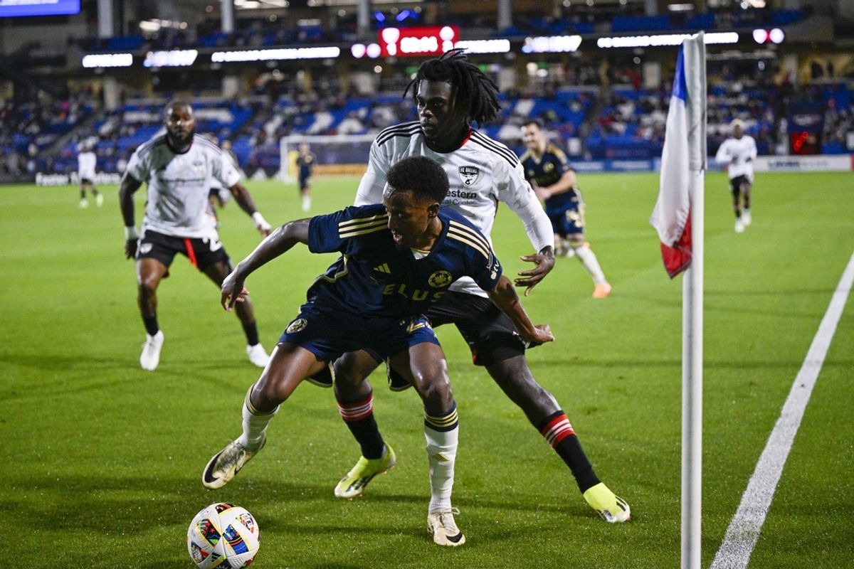 Mar 16, 2024; Frisco, Texas, USA; Vancouver Whitecaps forward Ali Ahmed (22) and FC Dallas midfielder Ema Twumasi (22) battle for control of the ball during the second half at Toyota Stadium. Mandatory Credit: Jerome Miron-Imagn Images