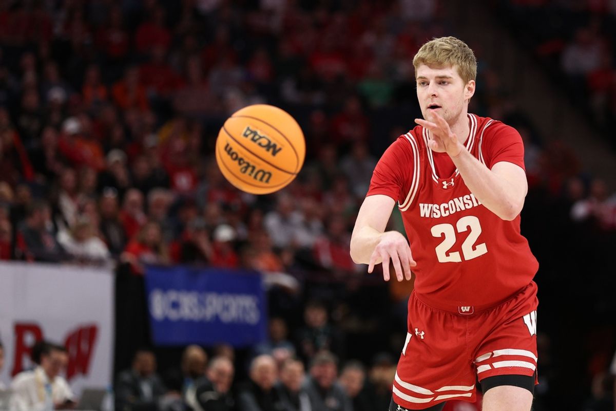 Mar 17, 2024; Minneapolis, MN, USA; Wisconsin Badgers forward Steven Crowl (22) plays the ball in the first half against the Illinois Fighting Illini at Target Center. Mandatory Credit: Matt Krohn-Imagn Images