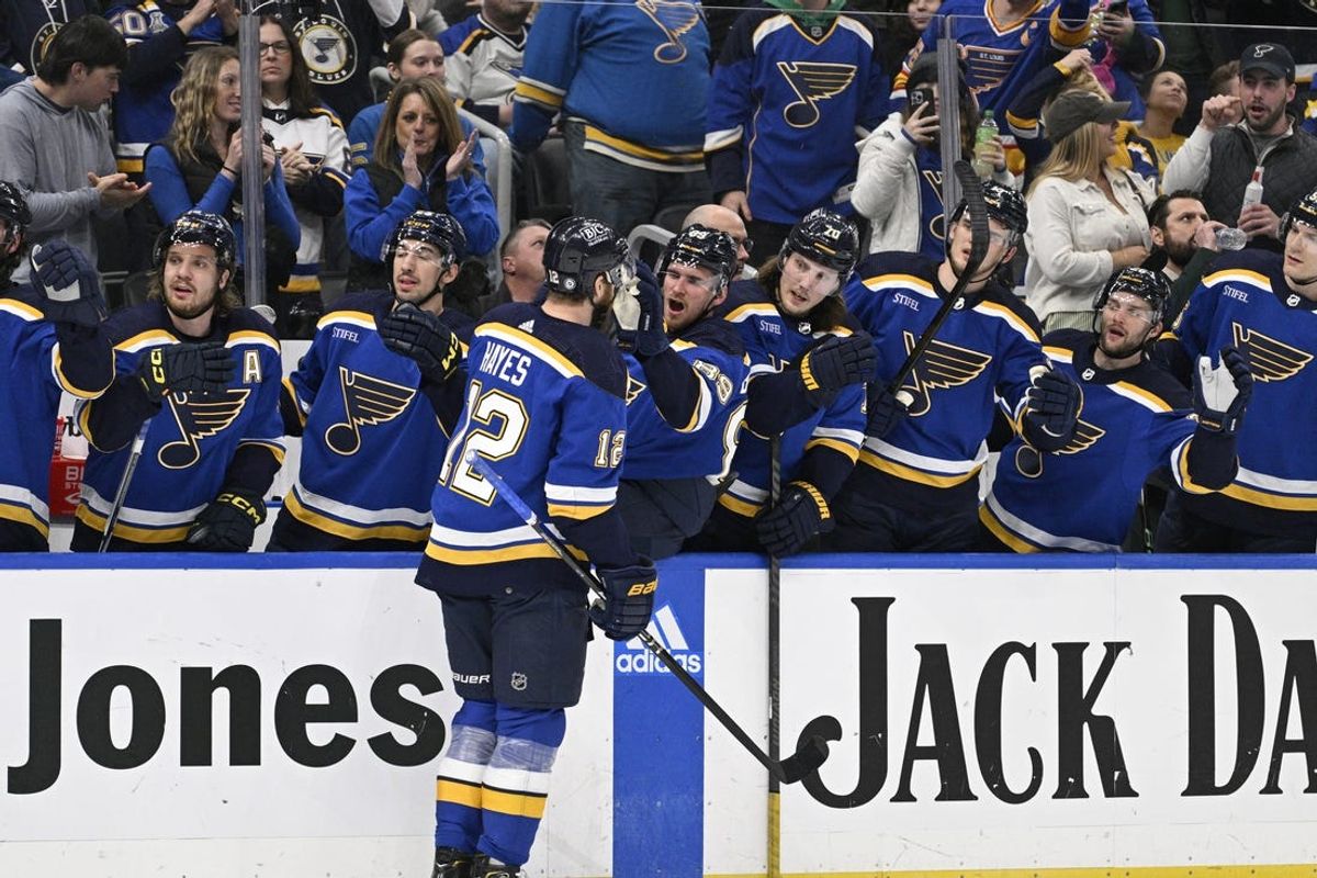 Mar 17, 2024; St. Louis, Missouri, USA; St. Louis Blues right wing Kevin Hayes (12) is congratulated by teammates after scoring a goal against the Anaheim Ducks during the second period at Enterprise Center. Mandatory Credit: Jeff Le-USA TODAY Sports