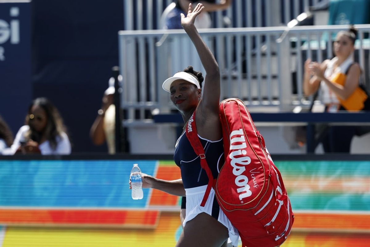 Mar 19, 2024; Miami Gardens, FL, USA; Venus Williams (USA) waves to the crowd while leaving the court after her match against Diana Shnaider (not pictured) on day two of the Miami Open at Hard Rock Stadium. Mandatory Credit: Geoff Burke-Imagn Images