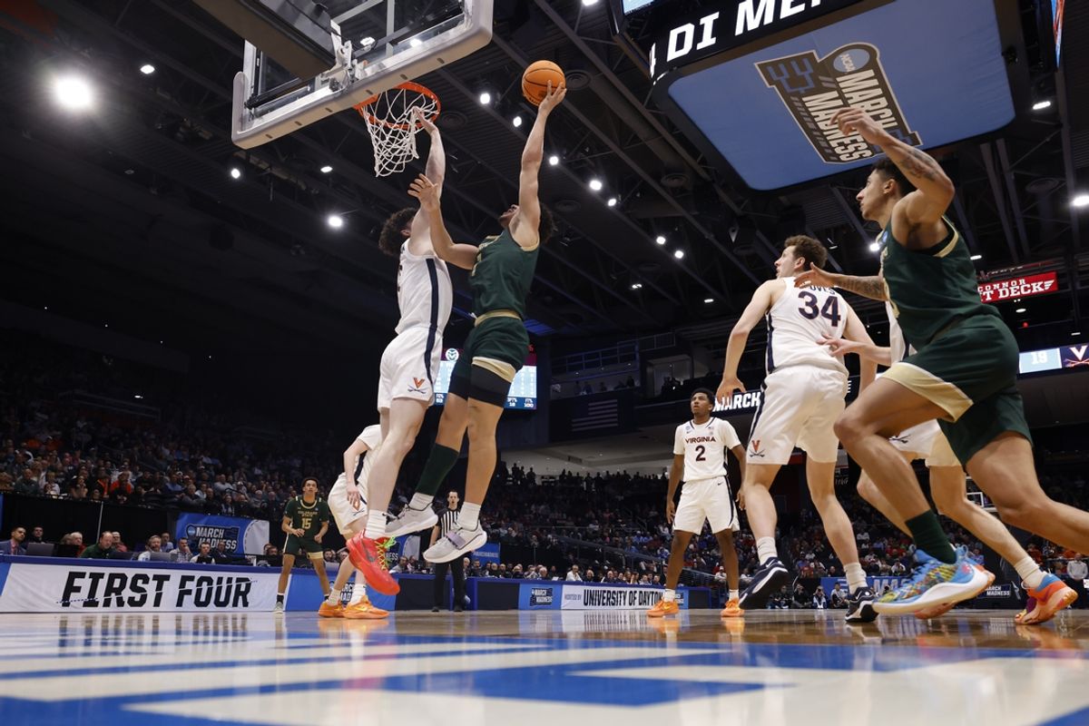 Mar 19, 2024; Dayton, OH, USA; Colorado State Rams forward Joel Scott (1) shoots the ball defended by Virginia Cavaliers forward Blake Buchanan (0) in the second half at UD Arena. Mandatory Credit: Rick Osentoski-Imagn Images