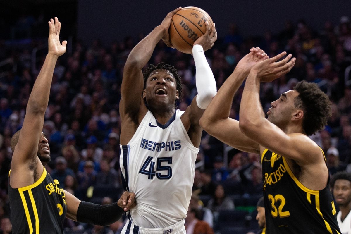 Mar 20, 2024; San Francisco, California, USA; Memphis Grizzlies forward GG Jackson II (45) goes up for a shot between Golden State Warriors defenders Chris Paul (3) and Trayce Jackson-Davis (32) during the third quarter at Chase Center. Mandatory Credit: D. Ross Cameron-Imagn Images