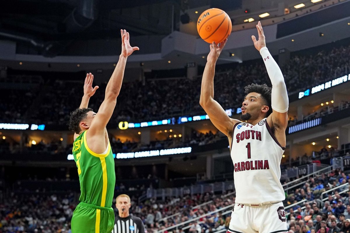 Mar 21, 2024; Pittsburgh, PA, USA; South Carolina Gamecocks guard Jacobi Wright (1) shoots the ball against Oregon Ducks guard Jackson Shelstad (3) during the first half in the first round of the 2024 NCAA Tournament at PPG Paints Arena. Mandatory Credit: Gregory Fisher-Imagn Images