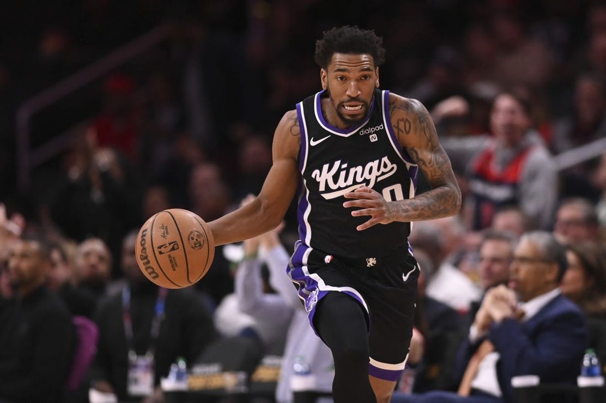 Mar 21, 2024; Washington, District of Columbia, USA;  Sacramento Kings guard Malik Monk (0) dribbles top the court during the first half against the Washington Wizards at Capital One Arena. Mandatory Credit: Tommy Gilligan-USA TODAY Sports