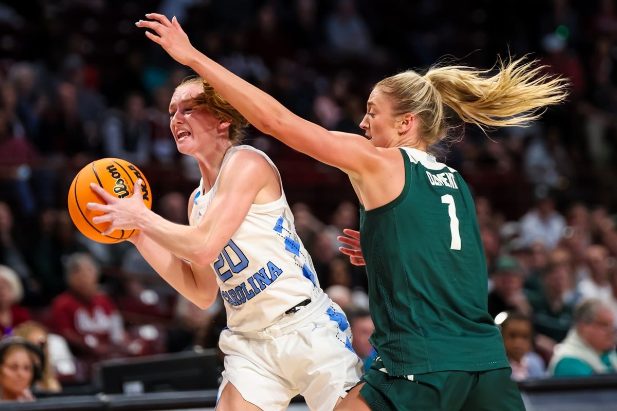 Mar 22, 2024; Columbia, SC, USA; North Carolina Tar Heels guard Lexi Donarski (20) is fouled by Michigan State Spartans guard Tory Ozment (1) in the second half at Colonial Life Arena. Mandatory Credit: Jeff Blake-Imagn Images