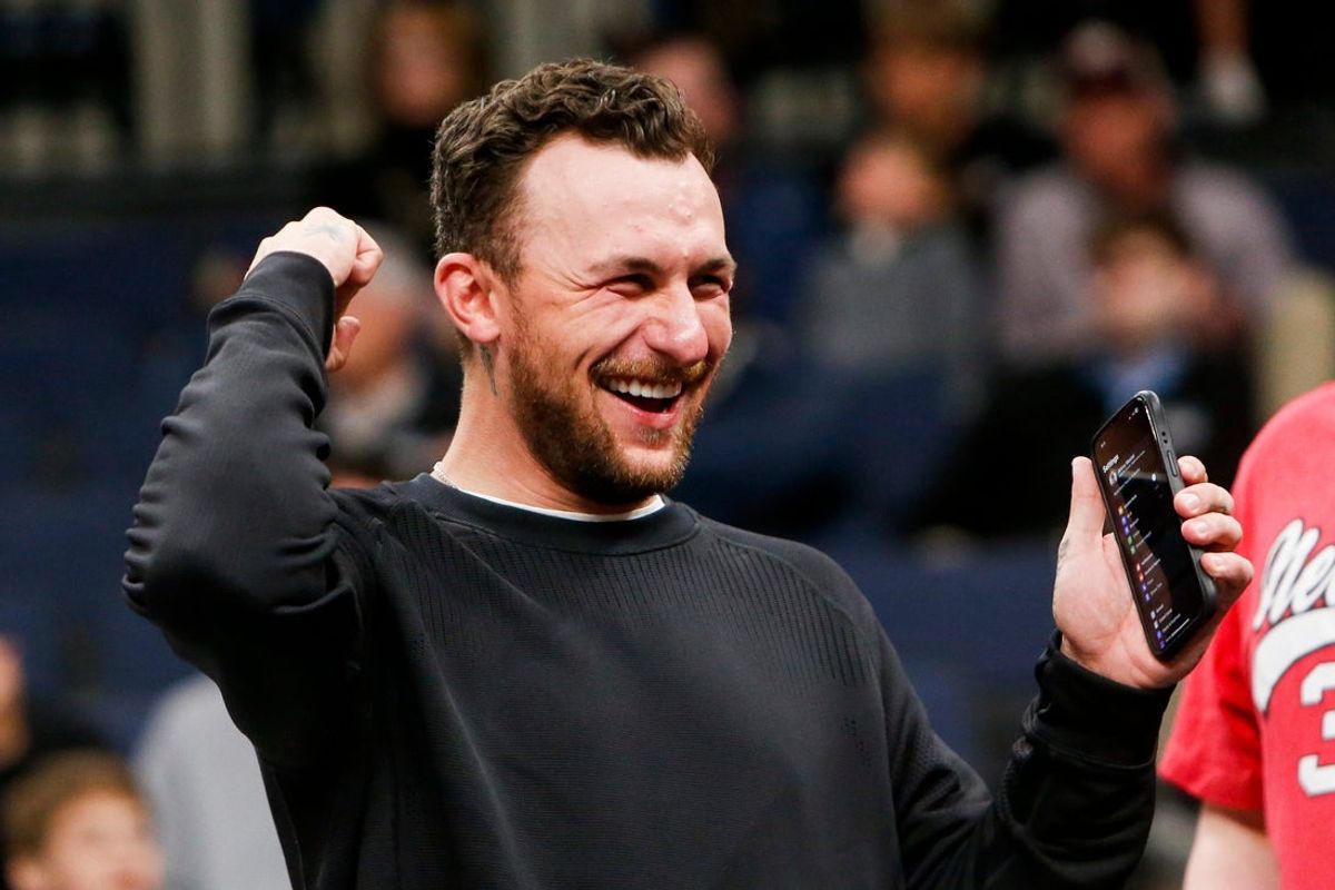 Former Texas A&M Heisman Trophy-winning quarterback Johnny Manziel cheers on the Aggies during the first round game between Texas A&M and Nebraska in the 2024 NCAA Tournament at FedExForum in Memphis, Tenn., on Friday, March 22, 2024.