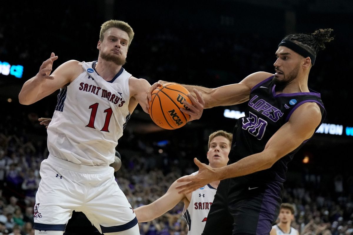 Mar 22, 2024; Spokane, WA, USA; St. Mary's Gaels center Mitchell Saxen (11) and Grand Canyon Antelopes forward Gabe McGlothan (30) fight for a rebound during the second half in the first round of the 2024 NCAA Tournament at Spokane Veterans Memorial Arena. Mandatory Credit: Kirby Lee-Imagn Images