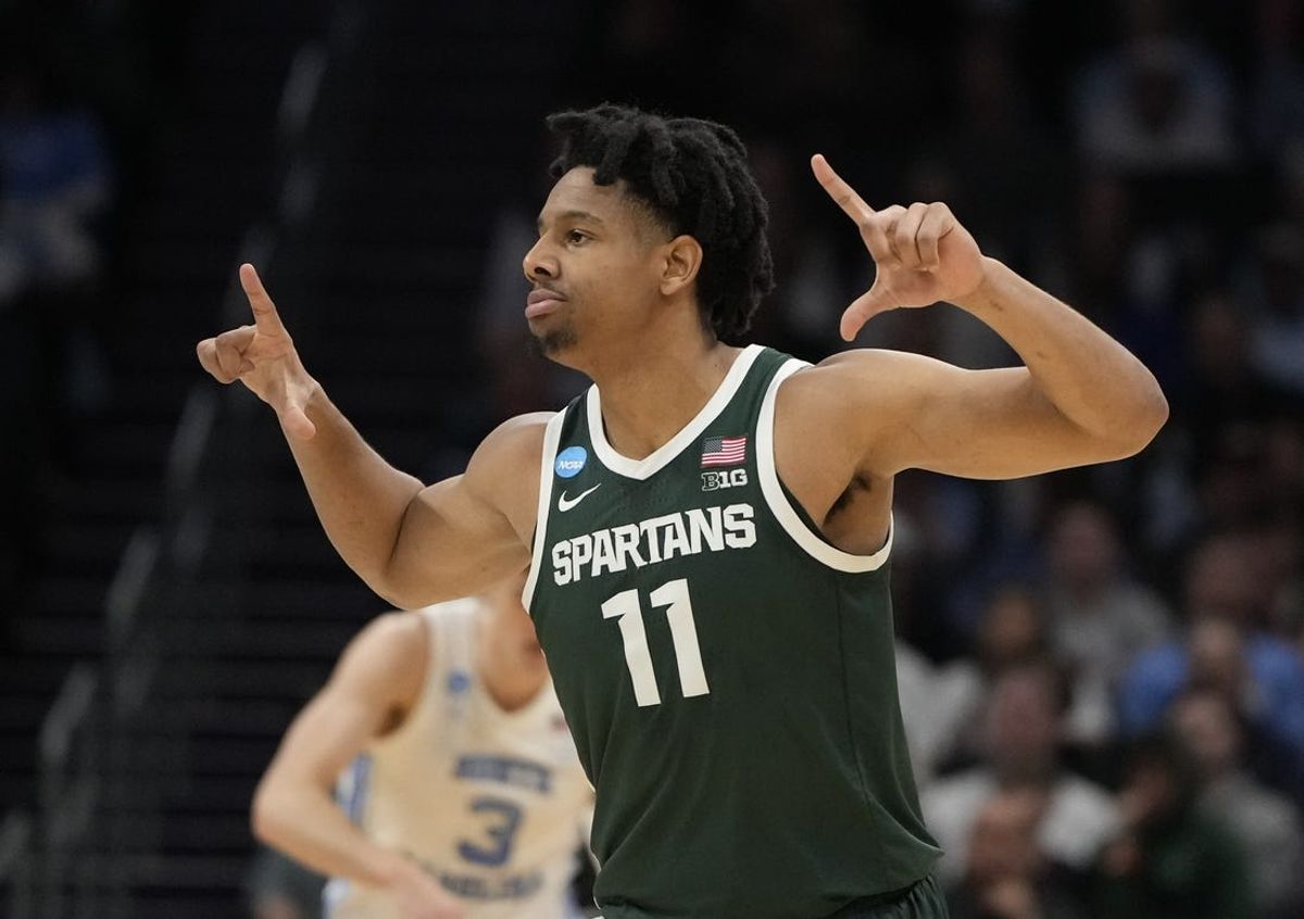 March 23, 2024, Charlotte, NC, USA; Michigan State Spartans guard A.J. Hoggard (11) reacts against the North Carolina Tar Heels in the second round of the 2024 NCAA Tournament at the Spectrum Center. Mandatory Credit: Bob Donnan-USA TODAY Sports