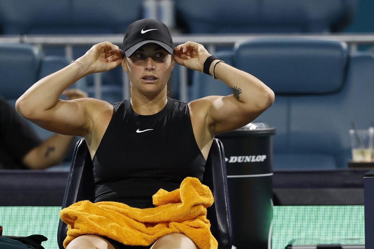 Mar 23, 2024; Miami Gardens, FL, USA; Aryna Sabalenka puts on a new cap after winning the second set against Anhelina Kalinina (UKR) (not pictured) on day six of the Miami Open at Hard Rock Stadium. Mandatory Credit: Geoff Burke-USA TODAY Sports