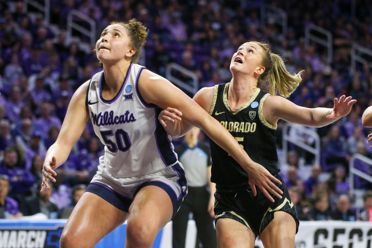 Mar 24, 2024; Manhattan, Kansas, USA; Kansas State Wildcats center Ayoka Lee (50) blocks out Colorado Buffaloes guard Kindyll Wetta (15) during the fourth quarter at Bramlage Coliseum. Mandatory Credit: Scott Sewell-Imagn Images