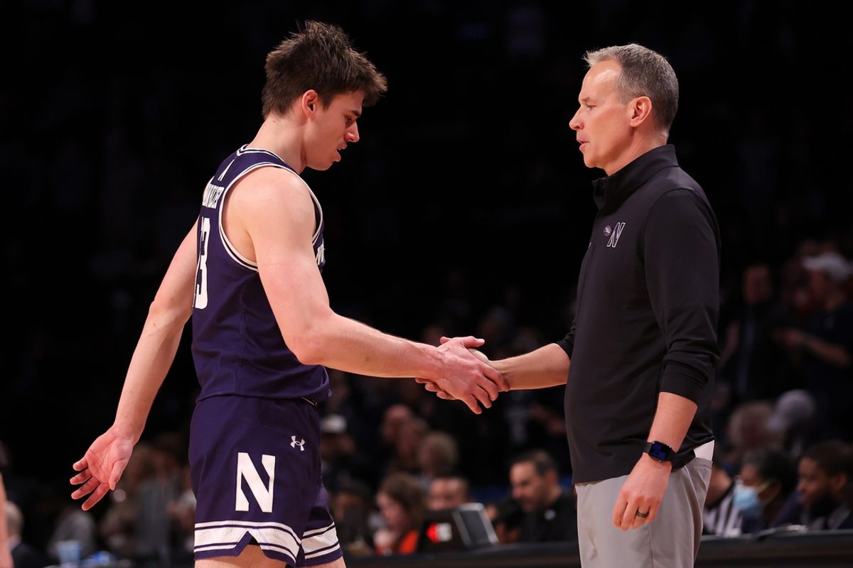 Mar 24, 2024; Brooklyn, NY, USA; Northwestern Wildcats head coach Chris Collins reacts with guard Brooks Barnhizer (13) in the second round of the 2024 NCAA Tournament at the Barclays Center. Mandatory Credit: Brad Penner-Imagn Images