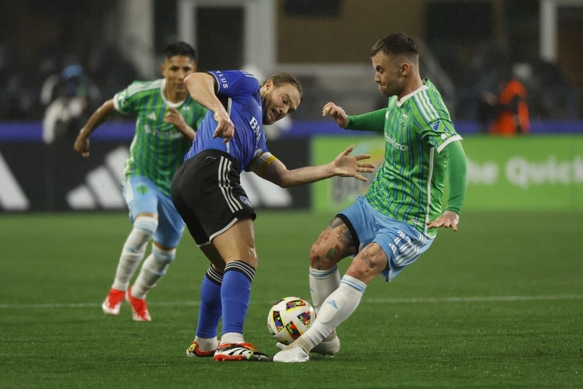 Apr 6, 2024; Seattle, Washington, USA; CF Montreal midfielder Samuel Piette (6) and Seattle Sounders FC midfielder Albert Rusnak (11) battle for the ball during the first half at Lumen Field.