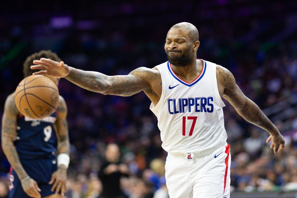 Mar 27, 2024; Philadelphia, Pennsylvania, USA; LA Clippers forward P.J. Tucker (17) reacts after being called for a foul against Philadelphia 76ers guard Kelly Oubre Jr. (9) during the second quarter at Wells Fargo Center. Mandatory Credit: Bill Streicher-Imagn Images
