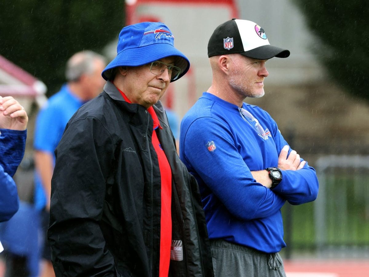 Bills owner Terry Pegula (L) visits with head coach Sean McDermott during training camp at St. John Fisher University.