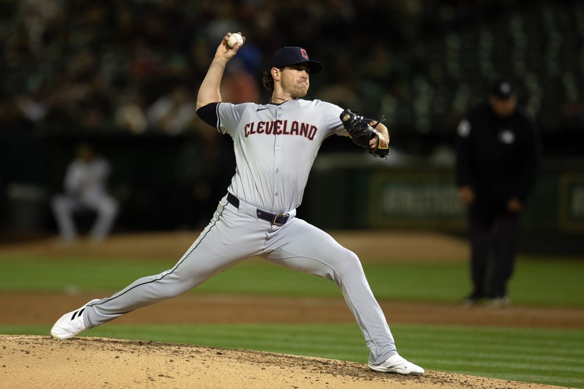 Mar 28, 2024; Oakland, California, USA; Cleveland Guardians starting pitcher Shane Bieber (57) delivers a pitch against the Oakland Athletics during the third inning at Oakland-Alameda County Coliseum. Mandatory Credit: D. Ross Cameron-Imagn Images