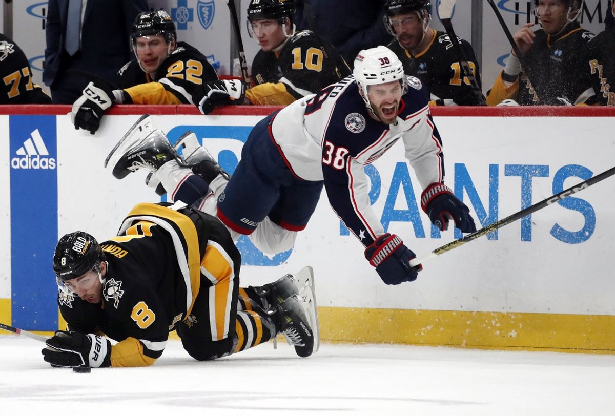 Mar 28, 2024; Pittsburgh, Pennsylvania, USA;  Pittsburgh Penguins left wing Michael Bunting (8) upends Columbus Blue Jackets center Boone Jenner (38) during the second period at PPG Paints Arena. Mandatory Credit: Charles LeClaire-Imagn Images