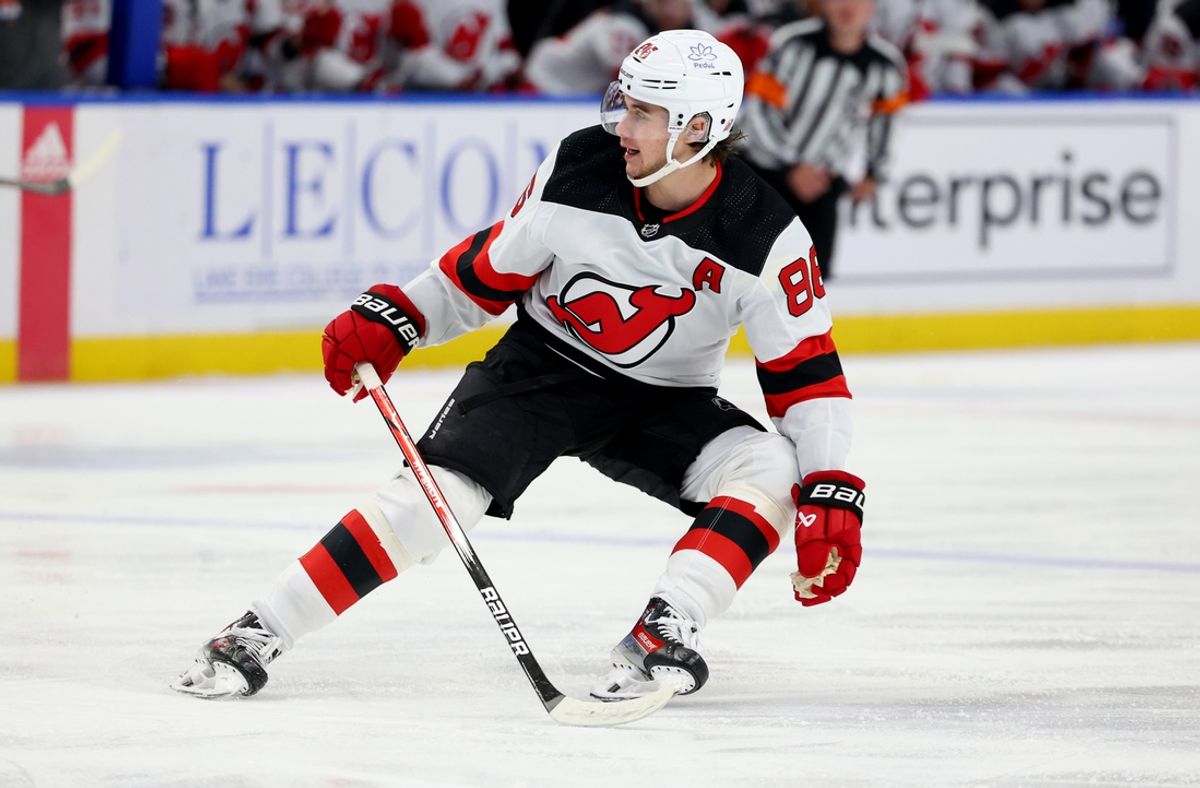 Mar 29, 2024; Buffalo, New York, USA;  New Jersey Devils center Jack Hughes (86) looks for the puck during the first period against the Buffalo Sabres at KeyBank Center. Mandatory Credit: Timothy T. Ludwig-Imagn Images