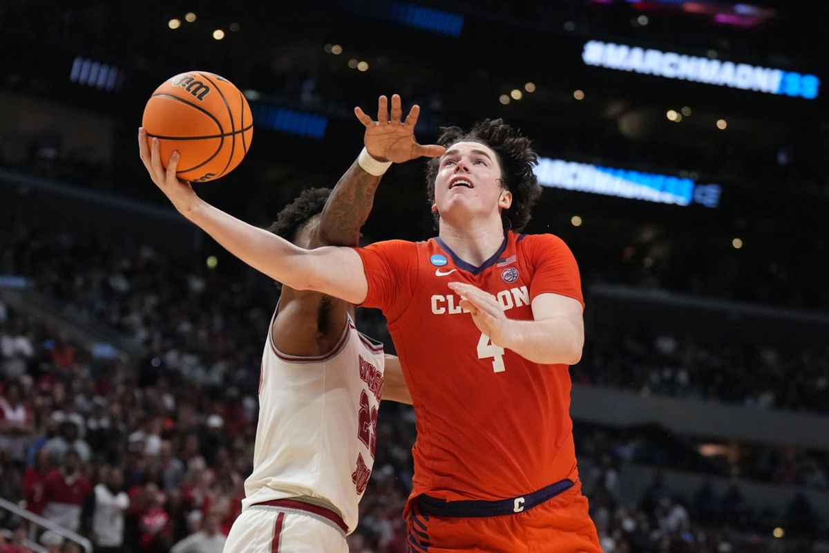 Mar 30, 2024; Los Angeles, CA, USA; Clemson Tigers forward Ian Schieffelin (4) shoots against Alabama Crimson Tide forward Nick Pringle (23) in the second half in the finals of the West Regional of the 2024 NCAA Tournament at Crypto.com Arena. Mandatory Credit: Kirby Lee-Imagn Images