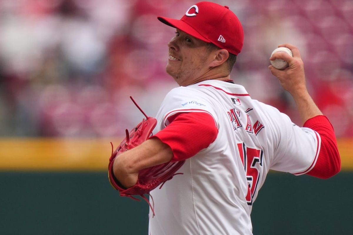 Cincinnati Reds relief pitcher Emilio Pagan (15) delivers a pitch in the sixth inning of a baseball game against the Washington Nationals, Sunday, March 31, 2024, at Great American Ball Park in Cincinnati.