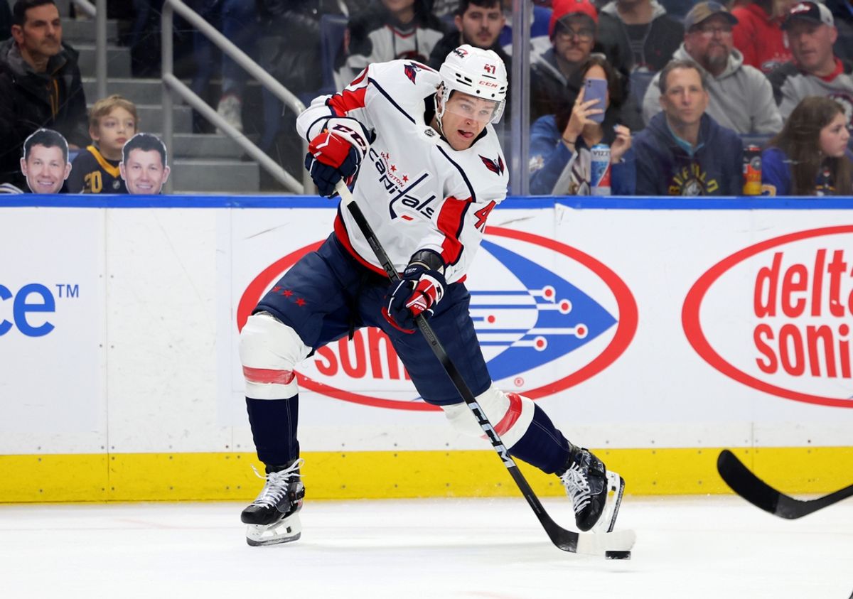 Apr 2, 2024; Buffalo, New York, USA;  Washington Capitals left wing Beck Malenstyn (47) takes a shot on goal during the first period against the Washington Capitals at KeyBank Center. Mandatory Credit: Timothy T. Ludwig-USA TODAY Sports