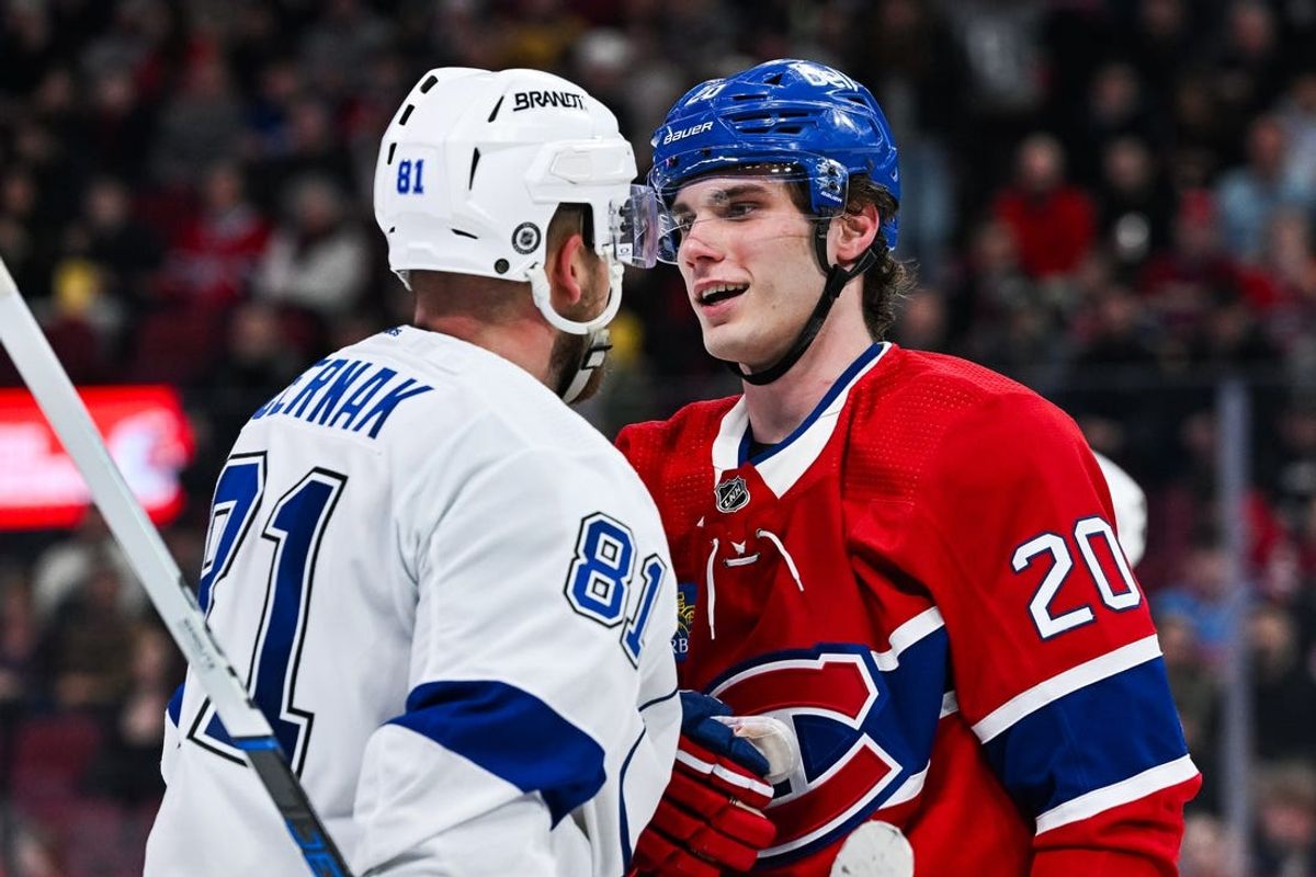 Apr 4, 2024; Montreal, Quebec, CAN; Montreal Canadiens left wing Juraj Slafkovsky (20) has a discussion with Tampa Bay Lightning defenseman Erik Cernak (81) during the second period at Bell Centre. Mandatory Credit: David Kirouac-USA TODAY Sports