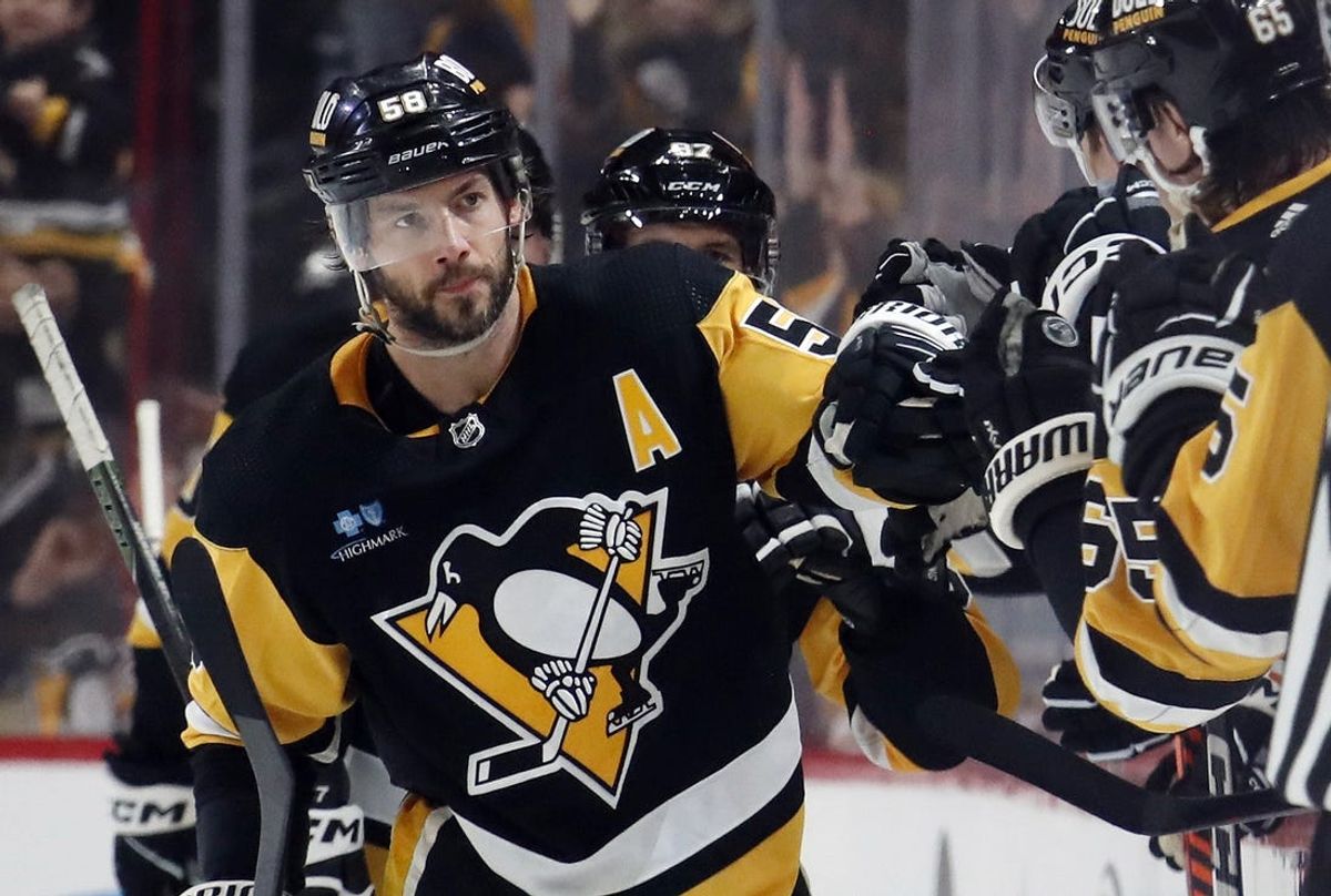Apr 6, 2024; Pittsburgh, Pennsylvania, USA;  Pittsburgh Penguins defenseman Kris Letang (58) celebrates with the Pens bench after scoring a goal against the Tampa Bay Lightning during the second period at PPG Paints Arena. Mandatory Credit: Charles LeClaire-USA TODAY Sp
