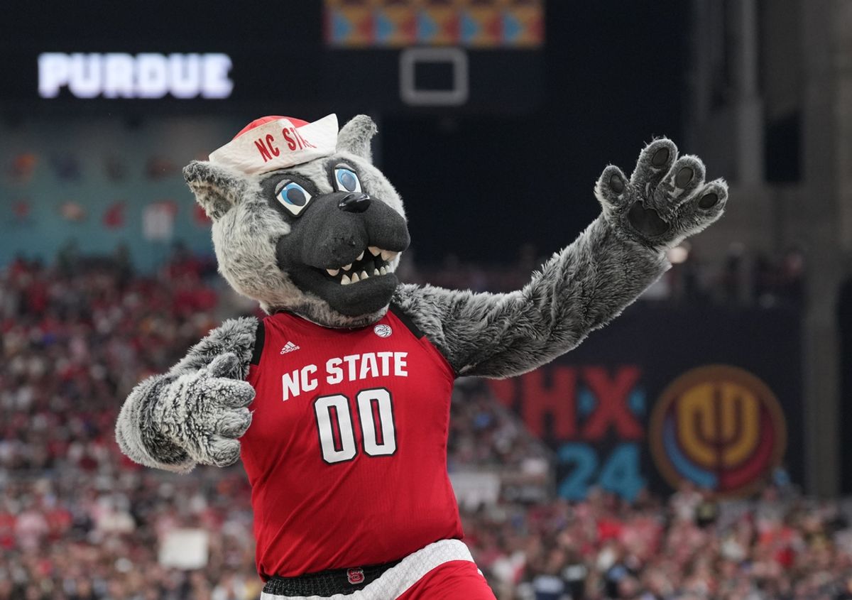 Apr 6, 2024; Glendale, AZ, USA; North Carolina State Wolfpack mascot performs against the Purdue Boilermakers in the semifinals of the men's Final Four of the 2024 NCAA Tournament at State Farm Stadium. Mandatory Credit: Robert Deutsch-Imagn Images