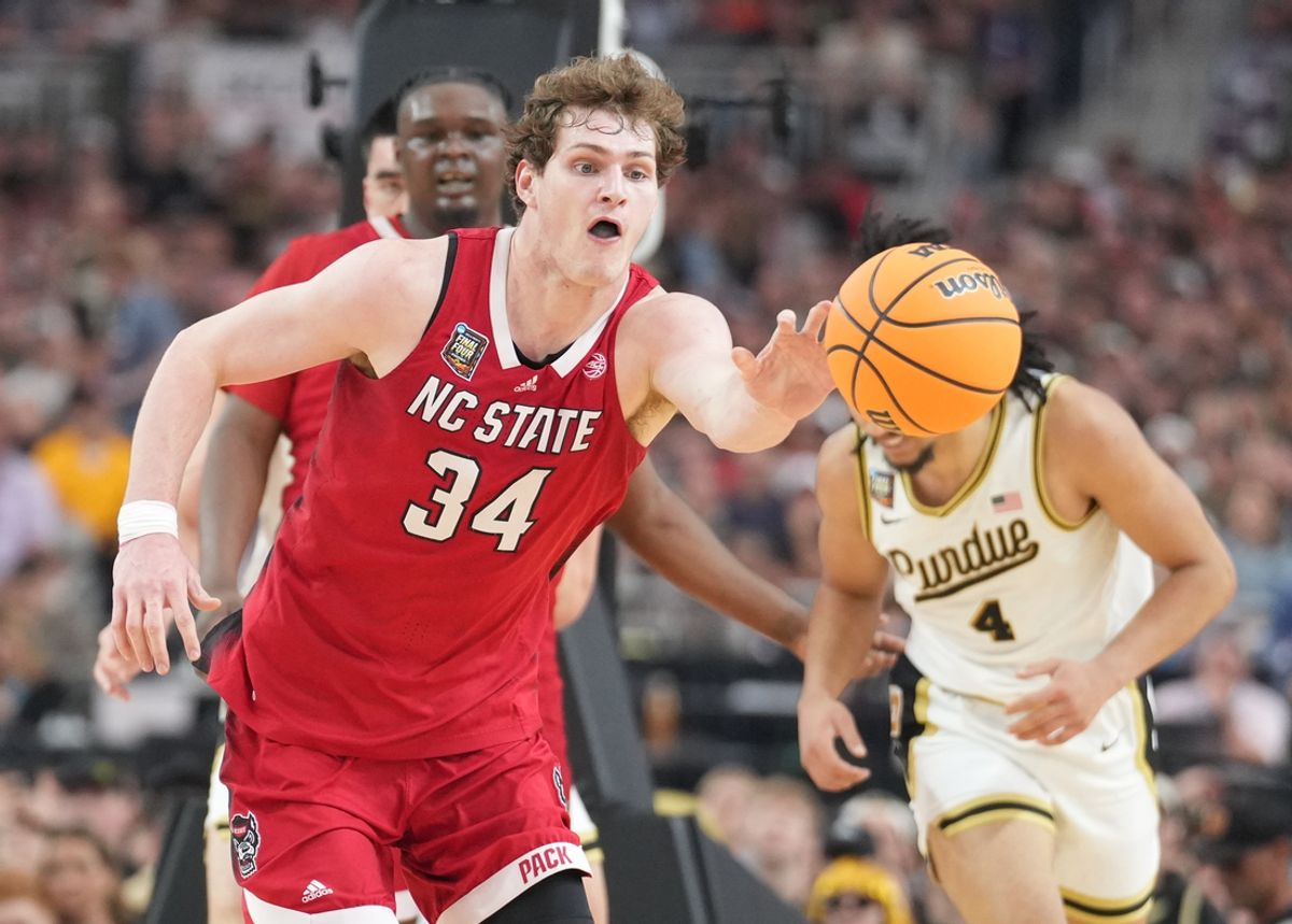 Apr 6, 2024; Glendale, AZ, USA; North Carolina State Wolfpack forward Ben Middlebrooks (34) reaches for the ball against the Purdue Boilermakers  in the semifinals of the men's Final Four of the 2024 NCAA Tournament at State Farm Stadium. Mandatory Credit: Robert Deutsch-Imagn Images