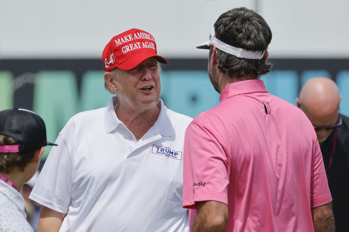 Apr 7, 2024; Miami, Florida, USA; Donald Trump, left, talks with Bubba Watson of the RangeGoats on the practice green before the final round of LIV Golf Miami golf tournament at Trump National Doral. Mandatory Credit: Reinhold Matay-Imagn Images