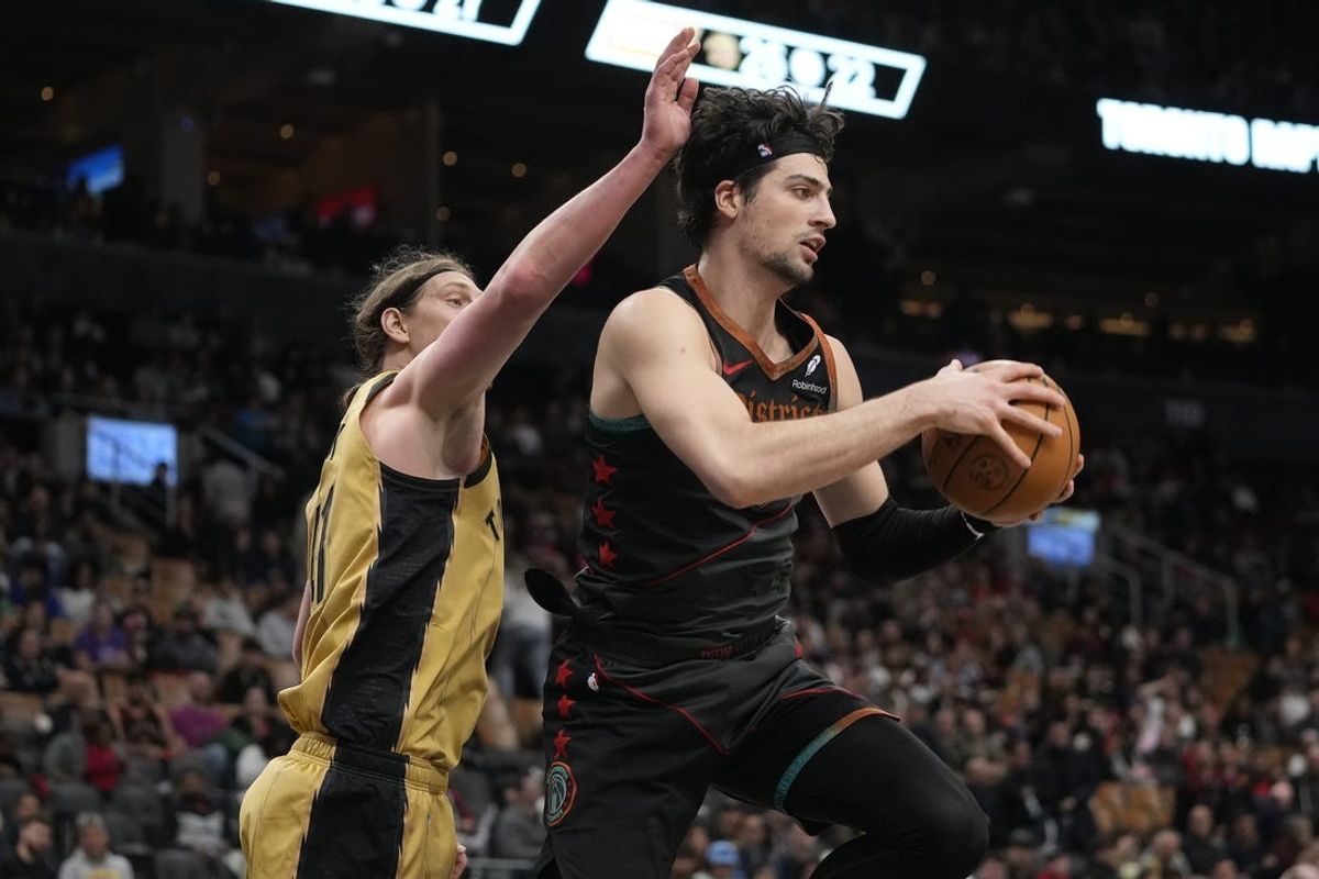 Apr 7, 2024; Toronto, Ontario, CAN; Washington Wizards forward Deni Avdija (8) comes down with a rebound against Toronto Raptors forward Kelly Olynyk (41) during the second half at Scotiabank Arena. Mandatory Credit: John E. Sokolowski-USA TODAY Sports