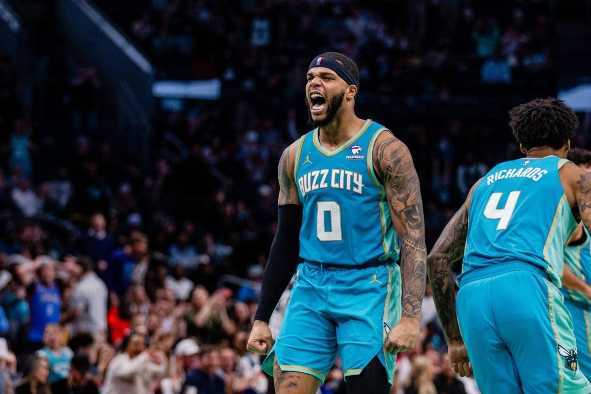 Apr 7, 2024; Charlotte, North Carolina, USA; Charlotte Hornets forward Miles Bridges (0) celebrates after scoring against the Oklahoma City Thunder during the fourth quarter at Spectrum Center. Mandatory Credit: Scott Kinser-USA TODAY Sports