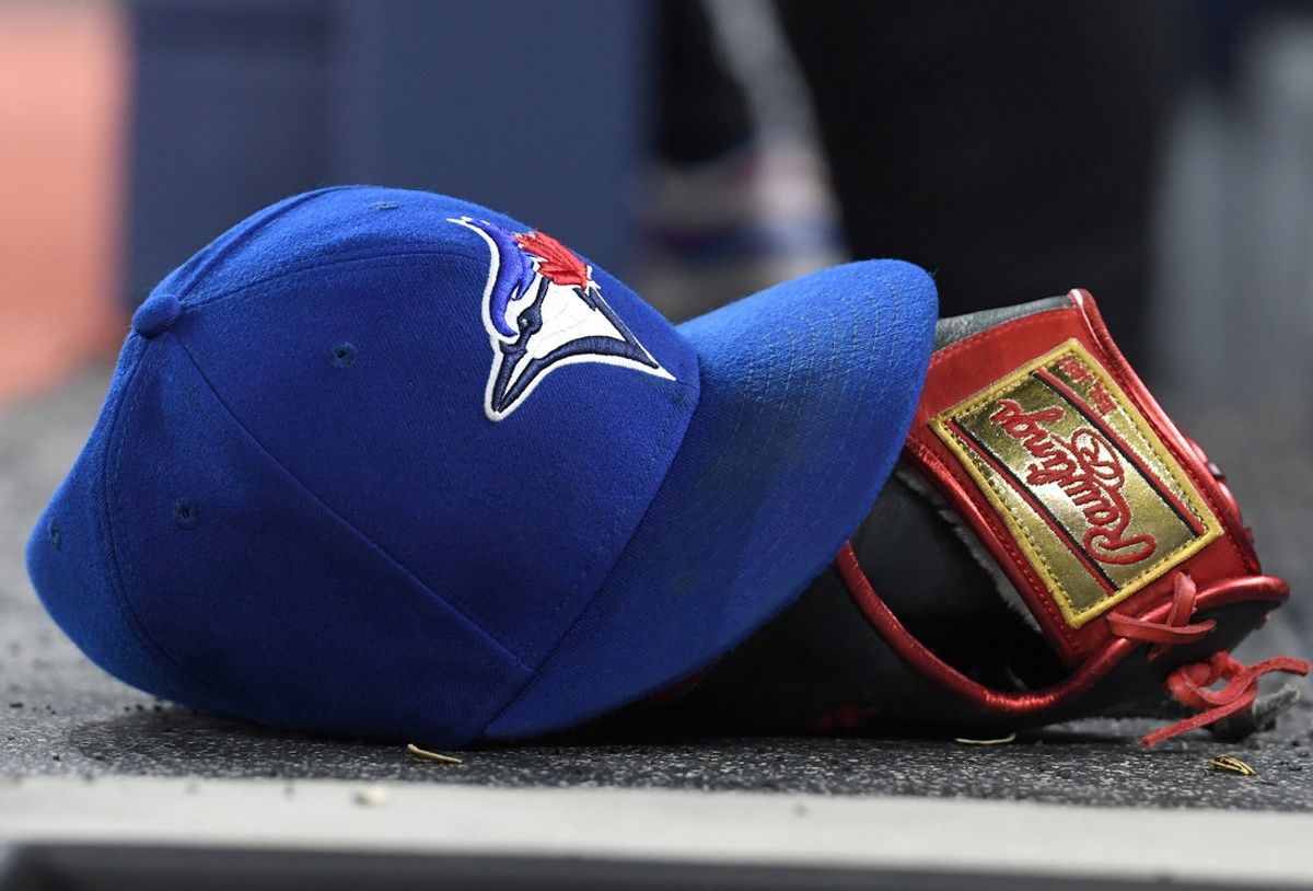 Apr 8, 2024; Toronto, Ontario, CAN;  A baseball cap and glove sit on the Toronto Blue Jays dugout steps as they host the Seattle Mariners in their home opener at Rogers Centre. Mandatory Credit: Dan Hamilton-Imagn Images
