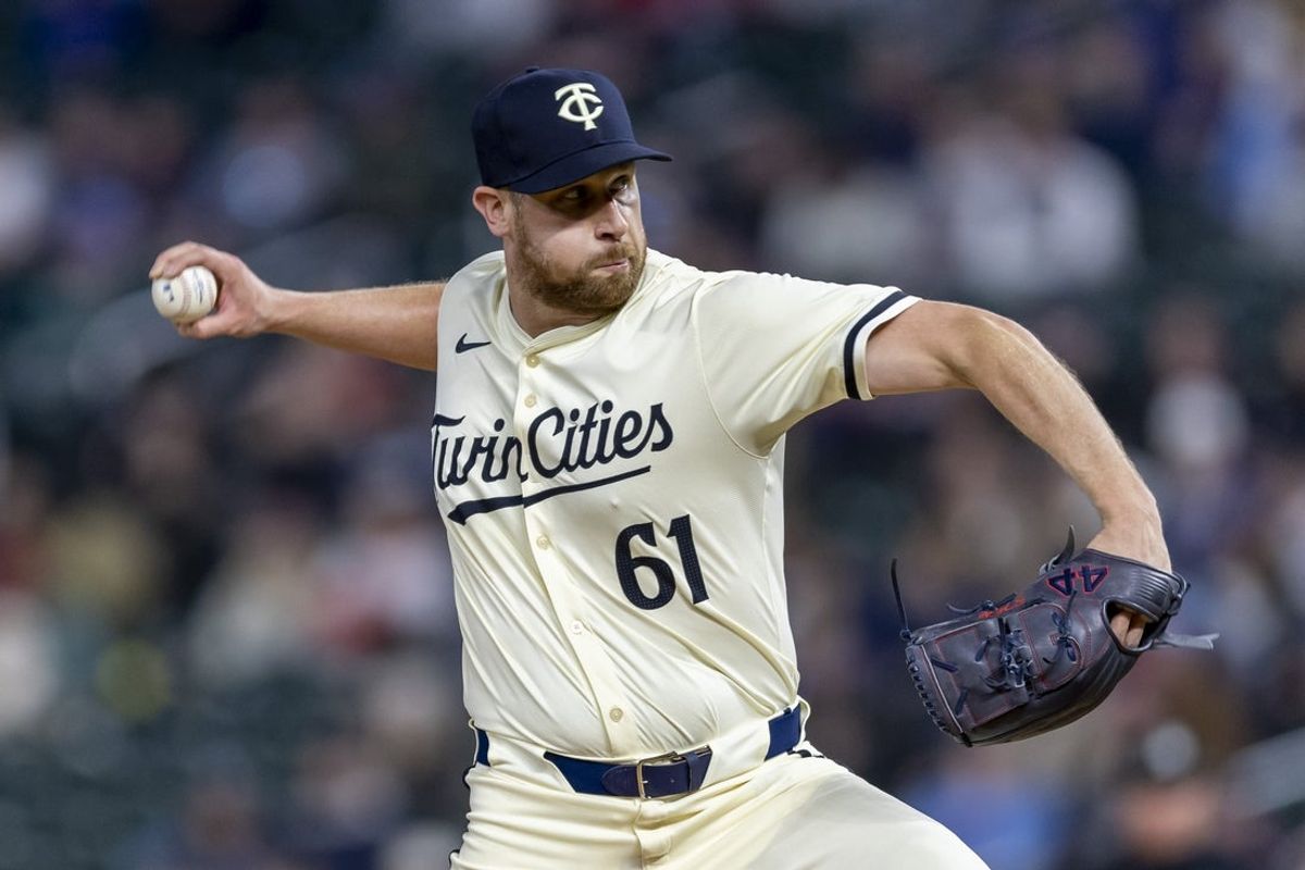 Apr 9, 2024; Minneapolis, Minnesota, USA; Minnesota Twins pitcher Brock Stewart (61) delivers a pitch against the Los Angeles Dodgers in the eighth inning at Target Field. Mandatory Credit: Jesse Johnson-Imagn Images